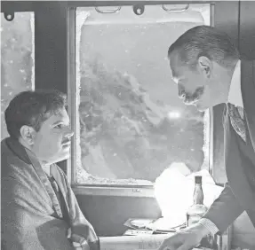  ??  ?? Personal assistant Hector MacQueen (Josh Gad, left) is questioned by Hercule Poirot (Kenneth Branagh) in “Murder on the Orient Express.” NICOLA DOVE