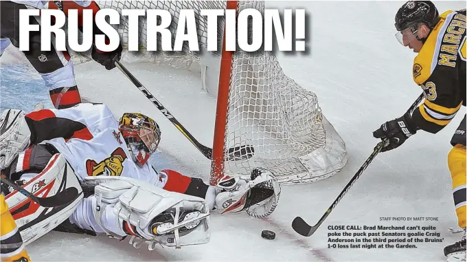  ?? STAFF PHOTO BY MATT STONE ?? CLOSE CALL: Brad Marchand can’t quite poke the puck past Senators goalie Craig Anderson in the third period of the Bruins’ 1-0 loss last night at the Garden.