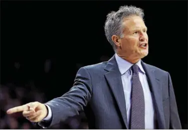  ?? MICHAEL PEREZ — THE ASSOCIATED PRESS ?? Philadelph­ia 76ers head coach Brett Brown calls a play from the bench during the second half of an NBA basketball game against the Milwaukee Bucks last season.