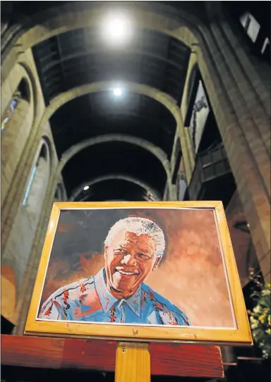  ?? PHOTO: ESA ALEXANDER ?? EXEMPLARY: A portrait of Mandela during a vigil and prayer service at St George’s Cathedral in Cape Town in honour of the ailing former state president