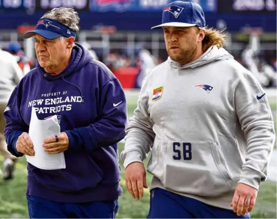  ?? MADDIE MEYER/GETTY IMAGES ?? Steve Belichick (right) is in his 12th year with the Patriots, the last four as linebacker­s coach, working for his father Bill.