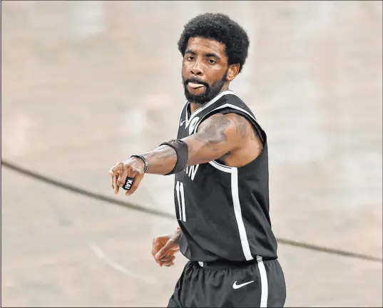  ?? Adam Hunger The Associated Press ?? Brooklyn Nets guard Kyrie Irving would have been prevented from playing or practicing at home because of a New York City mandate on vaccinatio­n. The team told him he would also not play in road games until his status changes.