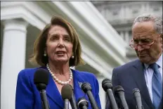  ?? ALEX BRANDON - THE ASSOCIATED PRESS ?? House Speaker Nancy Pelosi of Calif., left, and Senate Minority Leader Chuck Schumer of N.Y., speak with reporters after a meeting with President Donald Trump at