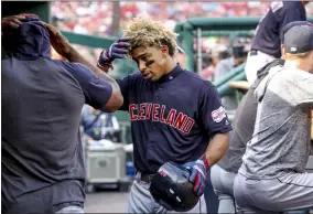  ?? ANDREW HARNIK — THE ASSOCIATED PRESS ?? Francisco Lindor returns to the dugout after scoring on a solo home run during the third inning Sept. 29 in Washington.