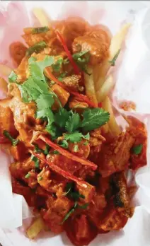  ??  ?? The butter chicken poutine is a creative take on the beloved Canadian classic poutine.