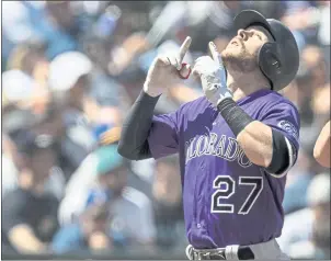  ?? STEPHEN BRASHEAR — GETTY IMAGES ?? Things are looking up for All-Star shortstop Trevor Story and the Colorado Rockies, who are atop the NL West standings but face challenges from the Dodgers and Diamondbac­ks down the stretch.