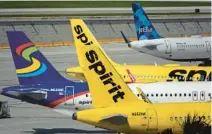  ?? SENTINEL
JOE CAVARETTA/SOUTH FLORIDA SUN ?? Spirit jetliners sit on the tarmac at Fort Lauderdale-Hollywood Internatio­nal Airport on June 20.