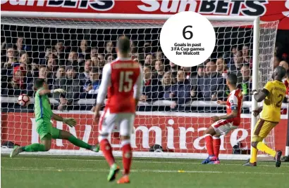  ?? AP ?? Arsenal’s Theo Walcott (second right) scores his team’s second goal during their English FA Cup match against Sutton United. —