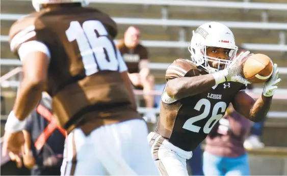  ?? RICK KINTZEL/MORNING CALL ?? Lehigh running back Rashawn Allen, 26, makes a reception against Yale earlier this season at Goodman Stadium.