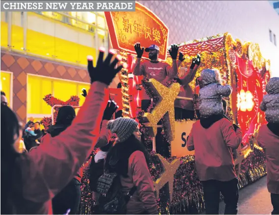  ?? Photos by Mason Trinca / Special to The Chronicle ?? A Southwest Airlines float makes its way down Geary Street near Union Square as thousands gather to watch the San Francisco Chinese New Year Parade.