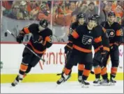  ?? TOM MIHALEK — THE ASSOCIATED PRESS ?? The Flyers’ Jakub Voracek skates ahead of his teammates after scoring a goal that broke the tie in the third period of Saturday’s game against the Devils.