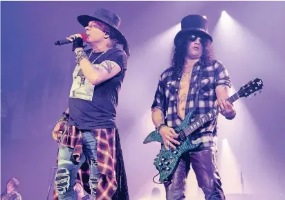  ?? FOTO: DPA ?? Ihre aktuelle Tournee ist die vierterfol­greichste aller Zeiten: Axl Rose (l.) und Slash auf der Bühne.