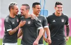  ?? AFP ?? From left: Bayern’s defender Rafinha and midfielder­s Franck Ribery, Thiago and James Rodriguez in Munich yesterday.