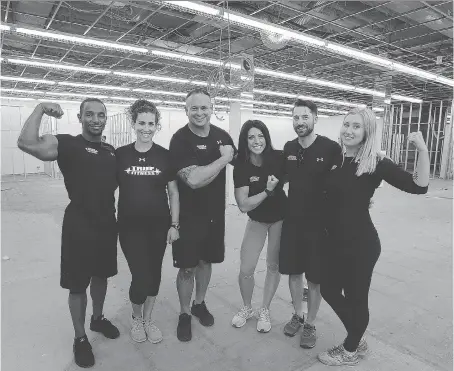  ?? PHOTOS: DAN JANISSE ?? Members of the True Fitness team, Wayne Bridge, left, Jessica Mendez, owner Luis Mendez, Gabby Tetreault, Marc Gaudette and Hannah Bruner show off their new home at 443 Ouellette Ave. on Thursday. It marks the second city location for the health and...