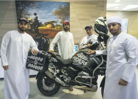  ?? Antonie Robertson / The National ?? Ambassador­s on two wheels: the Dubai Riders group, from left, Saif bin Saifan, Nasser Al Falasi, Saleh Al Sharif and Sami Hassan. The four will travel to Europe to help raise money for orphans