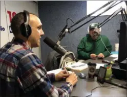  ??  ?? Regular Friday guest Greg Rempe, left, host of the Web-based “The Barbecue Central Show,” talks on the air with Jon Cupo on WINT’s “The Jon Cupo Show” on a recent morning.