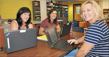  ?? SUBMITTED PHOTO ?? Ridge Park Elementary teachers Peggy Smith and Tara Homer working on the kindergart­en language arts curriculum with Whitemarsh Elementary’s Susan Hope.