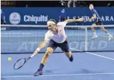  ??  ?? GEORGIOS KEFALAS/AP Switzerlan­d’s Roger Federer (L) returns a ball to Serbia’s Filip Krajinovic during their first round match at the Swiss Indoors in Basel, Switzerlan­d on October 23, 2018.