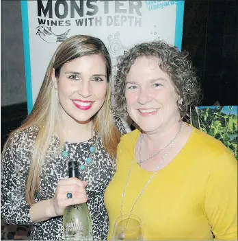  ??  ?? Stacey MacBride, left, introduced her Monster wines to Darlene Winterburn, executive director of the B.C. Shellfish Grower’s Associatio­n.