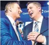  ??  ?? Maxime Bernier, left, congratula­ted Andrew Scheer after he won party leadership.