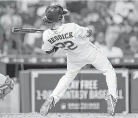  ?? Karen Warren / Houston Chronicle ?? Astros outfielder Josh Reddick shows his flexibilit­y while dodging a pitch in the seventh inning Tuesday night.