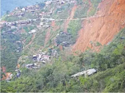  ?? AFP/GETTY IMAGES ?? Rescuers continued to search for miners feared buried beneath a landslide after Typhoon Mangkhut struck the Philippine­s.