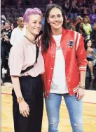  ?? Ethan Miller / Getty Images ?? From left, Sue Bird and Megan Rapinoe on the basketball court in Las Vegas, Nev., in July 2019. The two athletes, who live in Greenwich, recently announced their engagement.