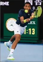  ?? The Associated Press ?? Canada’s Felix Auger-Aliassime returns to compatriot Denis Shapovalov at the Australian Open in Melbourne, Friday