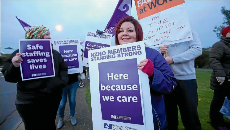  ?? KAVINDA HERATH/STUFF ?? Nurse Sandy Smith takes part in a nationwide 24-hour strike yesterday for better pay, better working conditions and to call for better funding for district health boards.