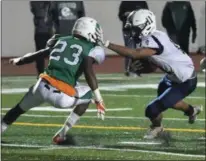  ?? ERIC BONZAR — THE MORNING JOURNAL ?? Lorain running back Daylin Dower (11) stiff-arms his way past Bedford’s Dionte Clemis (23) on Oct. 20.