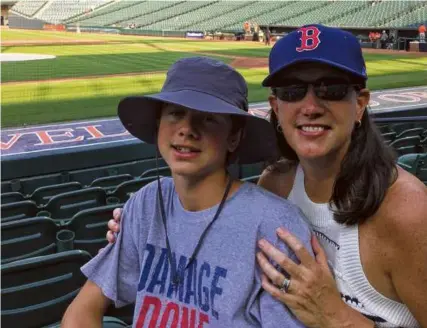  ?? ?? Lisa Murray with her son, Jack, at a Red Sox-Orioles game at Camden Yards in Baltimore.