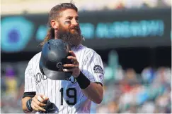  ?? DAVID ZALUBOWSKI/ASSOCIATED PRESS ?? Rockies center fielder Charlie Blackmon began growing his beard in 2013 and it even has a Twitter account in its honor.
