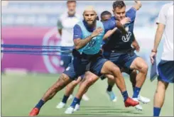 ?? ?? Members of the US team warm up for a training session at Al Gharafa Stadium on Sunday.