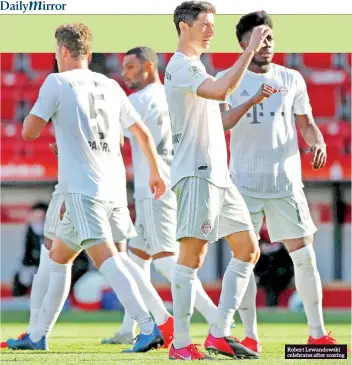  ??  ?? Robert Lewandowsk­i celebrates after scoring