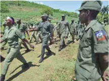  ?? THONY BELIZAIRE AGENCE FRANCE-PRESSE ?? Reconstitu­er l’armée répond, selon le ministre de la Défense d’Haïti, au besoin de respecter la Constituti­on qui établit l’existence d’un corps militaire aux côtés de la police.