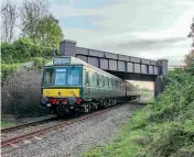  ?? ?? The Gloucester­shire Warwickshi­re Railway’s three-car Class 117 DMU passes under Bridge 8, north of Stanway, during the line’s 40th anniversar­y gala on November 7 (see pages 72-75). The G/WR Trust has launched an appeal for £200,000 to repair the bridge’s corroded steelwork.
IAN CROWDER