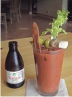  ??  ?? Mimosa’s loaded Bloody Mary with a beer chaser.