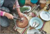  ?? AFP PHOTOS ?? Millions of Thais across the rural northeast eat koi pla — a local dish made of raw fish ground with spices and lime. The meal is quick, cheap and tasty, but it is also a favorite feast for parasites that can cause a lethal liver cancer.