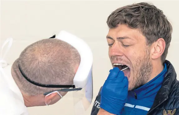  ?? Pictures: PPA. ?? Saints midfielder Murray Davidson pictured during his Covid-19 swab test at Mcdiarmid Park yesterday.