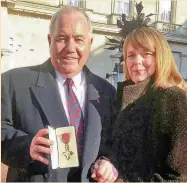  ??  ?? What More UK director Tony Grimshaw at Buckingham Palace with his wife Helen