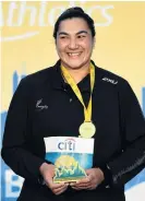  ?? PHOTO: GETTY IMAGES ?? Pretty pleased . . . New Zealand’s Lisa Adams poses with her gold medal after winning the women’s shot put F37 at the IPC World Para Athletics Championsh­ips in Dubai at the weekend.