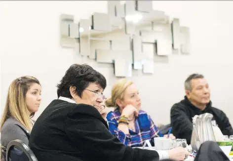  ?? MICHAEL BELL ?? Hazel Dixon, centre left, elder-in-residence at Regina Public Schools, and her colleagues listen to a presentati­on on mental health for First Nations students. The session was aimed at helping Indigenous students, who report higher levels of anxiety...