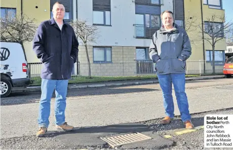  ??  ?? Hole lot of botherPert­h City North councillor­s John Rebbeck and Ian Massie in Tulloch Road