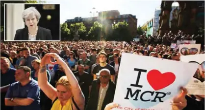  ?? — AP photos ?? Crowds gather for a vigil in Albert Square in Manchester yesterday, a day after a suicide attack at a concert that left 22 people dead. (Inset) British Prime Minister Theresa May addresses the media outside 10 Downing Street in London yesterday.