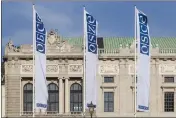  ?? LISA LEUTNER — THE ASSOCIATED PRESS FILE ?? Flags wave in the wind in front of the entrance of the Permanent Council of the Organizati­on for Security and Cooperatio­n in Europe, OSCE, in Vienna, Austria, on Feb. 15, 2022.