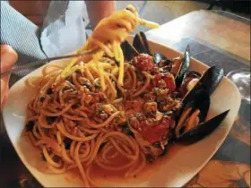  ?? JANET PODOLAK — THE NEWS-HERALD ?? This mixed seafood pasta is a customer favorite, although a signature dish at Piero’s Pasta House is a sauce of ground fennel sausage in creamy parmesan with cognac.