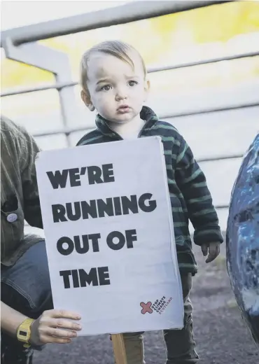  ??  ?? 0 Elliot Houdin- Mcaveet, who is just 20 months old, joins climate protests in Glasgow