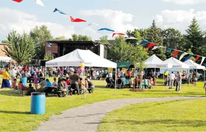  ?? PHOTOS (4): COURTESY OF VILLE DE MONTRéAL ?? Inaugural festivitie­s in St. Michel’s René-Goupil Park celebrated its redevelopm­ent in 2012 while cultural events in the community included this performanc­e by Haitian dancers from La Perle Retrouvée (below).