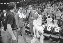  ??  ?? Thunder guard Luguentz Dort leaves the court after tip-off is delayed.