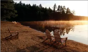  ??  ?? TOP: The sun rises over the lake at Huttopia in the White Mountains of New Hampshire. The glamping property has a private beach, heated swimming pool, hiking paths, canoe and SUP rentals, basketball and volleyball courts and a ping pong table.